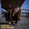 Download track A Day On Solid Ground