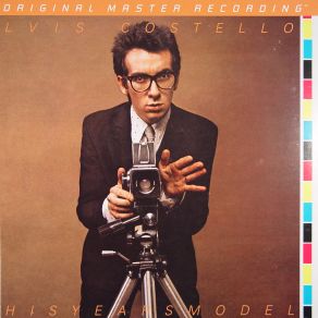 Download track This Year'S Girl Elvis Costello