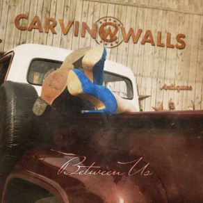 Download track Between Us Carvin Walls