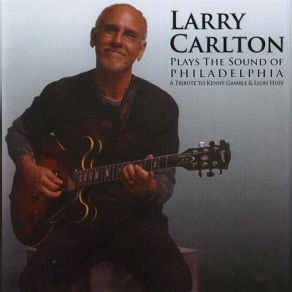 Download track Mama Canґt Buy You Love Larry Carlton